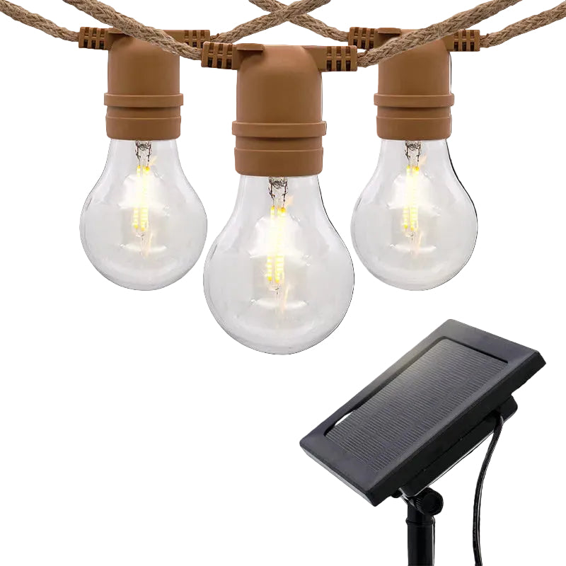 String lights with clear bulbs and brown connectors, featuring a solar panel 